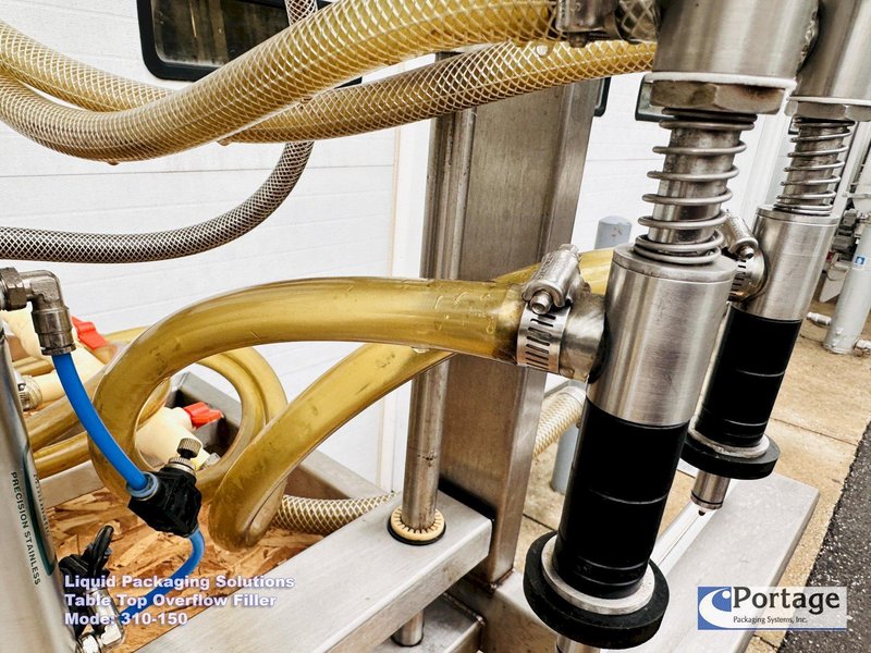 Liquid Packaging Solutions Model: 310-150  ||  Semi-Automatic Table Top Overflow Filler