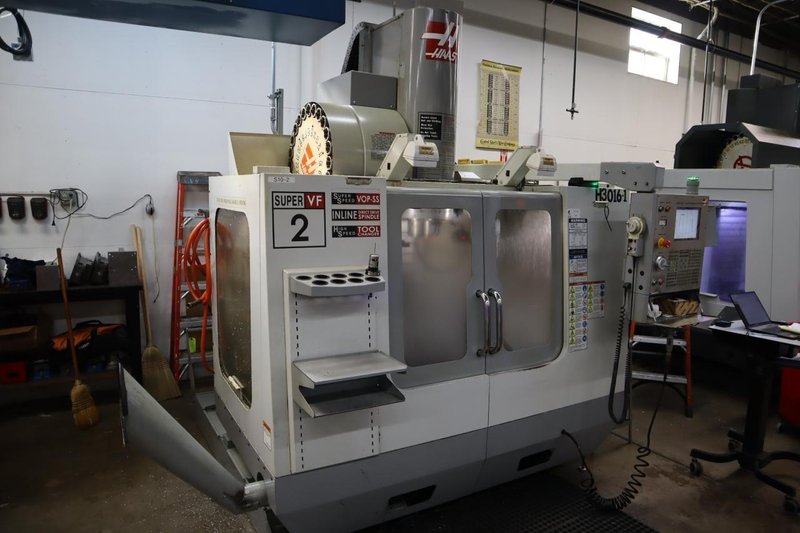 Haas VF-2SS CNC Vertical Machining Center, 12K Spindle, 4th Axis Brushless Drive with SHRT-160H Rotary Table, 24 Station SMTC, Probing, Chip Auger - Auction Item