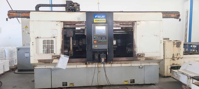 FUJI TNW-35TR 6-AXIS TWIN SPINDLE LIVE TOOL LATHE W/ GANTRY LOADER, 2007- Twin Turrets, 8″ Chucks x2