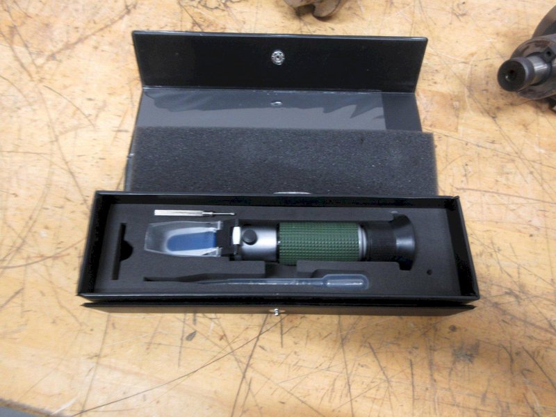 Redline CAT50 Shell Mill Holder, Sandvik 4.5" Shell Mill, ER32 Collet Wrenches, Box of Loc-Line, Zebra Refractometer, 3 Uknown Tool Holders- Auction Item