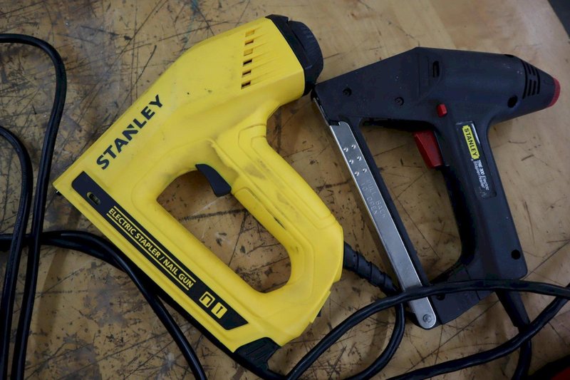 Milwuakee M12 Cordless Rivet Too., (2) Stanley Electric Staplers, Wagner Heat Gun, Extension Cord Reel, Glue Gun- Auction Item