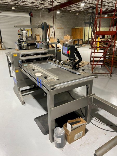 System Packaging 900-24 3B Labeler, 2020 – Weber Box Label Printer/Applicator Model: 5300 L.H. DOM, 1 Pallet of Cold Seal Material Included **Pre-Removal Pricing**