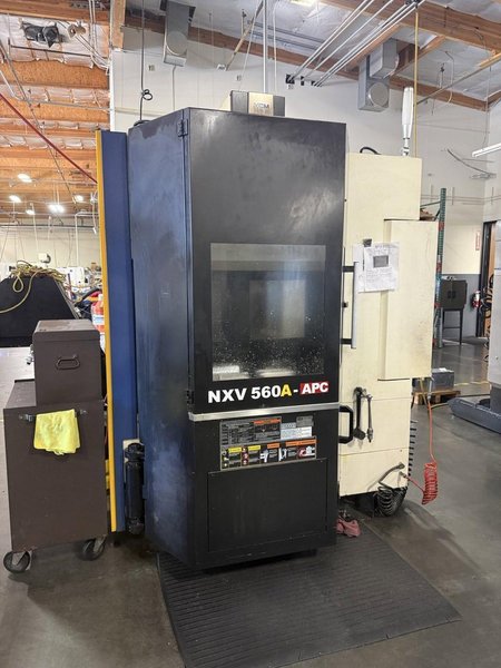 YCM NXV560A-APC VMC, 2015 – Chip Conveyor, Fanuc Control, 12K RPM