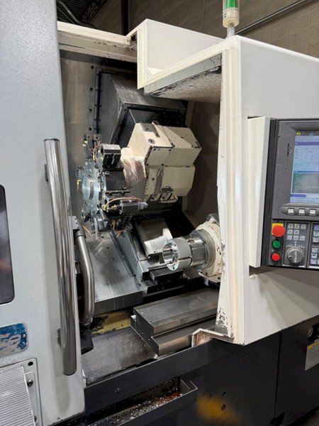 Okuma Genos L-300-MYW-e , 10″ 3-Jaw Kitagawa Chuck Main Spindle, 6″ 3-Jaw Kitagawa Chuck Sub Spindle, Y Axis, 12-Station Live Tool Turret, Tool Presetter, Parts Catcher, Chip Conveyor