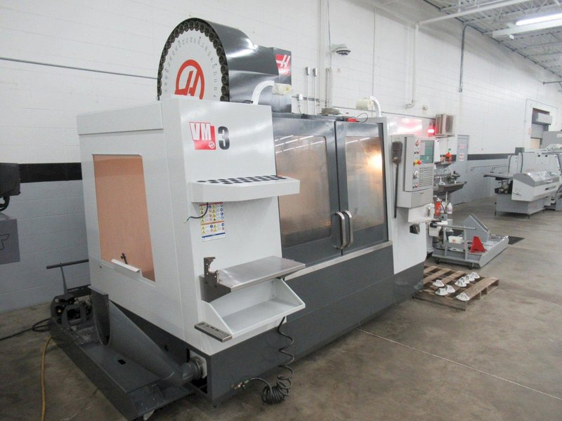 Haas VM-3 5-Axis CNC Vertical Machining Center, Haas TR-210 Trunnion, 40 Station Tool Changer, Probing, 300 PSI TSC, Chip Auger