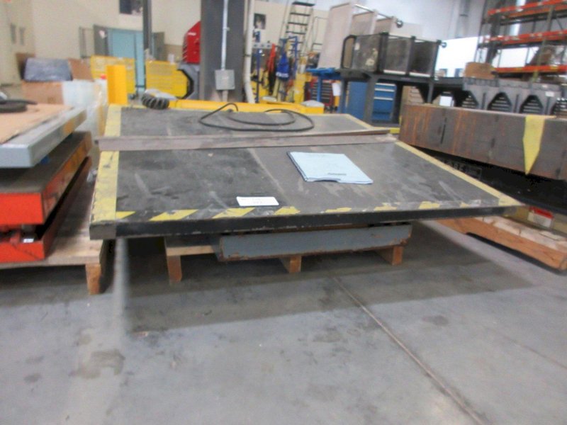 Autoquip Series 35 Scissors Lift  with 56" x 48" Table, Transition Ramp, Remote Foot Trip- Auction Item