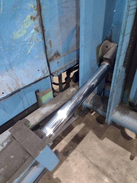 20,000 LBS BRANER HYDRAULIC COIL UPENDER WITH POWER FEED CONVEYOR: YOBRO #25238