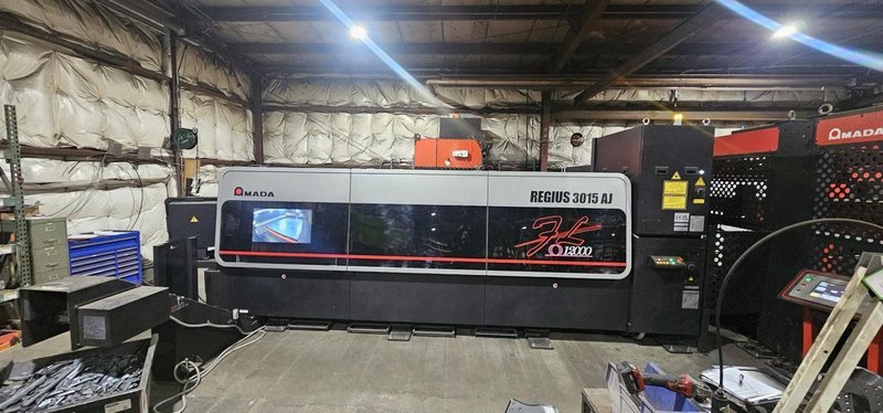 12,000 Watt Amada Regius 3015AJ Fiber Laser, 2023 – 5’x10′, Low Hours,  W/ AMS3015CL Single Pallet Automation
