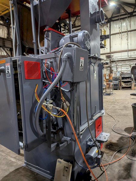2012 DeLong 7 super model DSTB7 rubber belt tumblast machine s/n 0066281 rated at 7 cu ft capacity, 20hp direct drive shot wheel, offered rebuilt