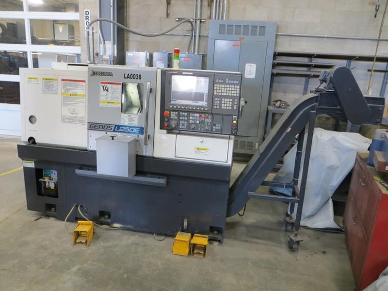 Okuma Genos L250E CNC Turning Center, OSP-P300L/R CNC Control, 8&quot; Chuck, Tool Setter, Parts Catcher, 12-Station Turret, Tailstock, Chip Conveyor