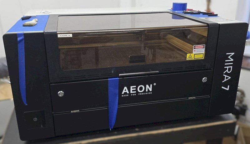 AEON MIRA7 Laser 60w Class 1 CO2 Laser w/Motorized Z Table, Blade Table, 2.0" Focal Lens, Red Dot Beam Combiner, Clean Pack Design, Built-In Air Compressor, Built-In Exhaust Fan, Built-In Water Chiller