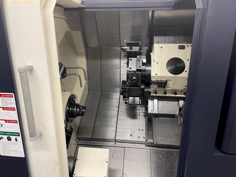 Hwacheon Cutex-180BL YSMC Multi-Axis CNC Lathe 2018 with: Fanuc OiTF CNC Control, Horizontal Linear Guide, Slant Longbed, 8" Chuck, Milling, Tool Presetter, High Pressure Pump, HTLD, Barfeed Interface, Rigid Tapping, Parts Catcher, and Chip Conveyor.