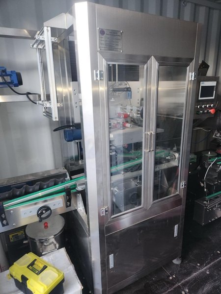 APM-USA Encapsulation Line, 2020 – Filler, Counter, Capper, Labeler, Sleeve Shrink, Sealer, Conveyors