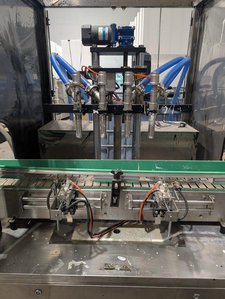 Liquid Filling Line with Automatic 4 Nozzle Servo Gear Pump Filler, Lid Presser, Labeler, Turntables, and Conveyors, 2024