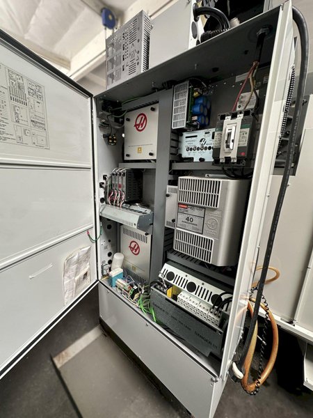 HAAS VM-2 CNC Vertical Machining Center 2011 equipped with quipped with 30"x20"x20" Travels, Haas Control, 4th Axis Drive, 24 ATC Side Mount Tool Changer, Tool Pre-Setter, Cool, Chip Auger