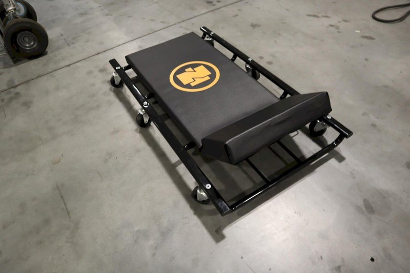 Northern Tool 44" Wide Cushion Creeper with 6 Swivel Wheels and Adjustable Head Rest- Auction Item