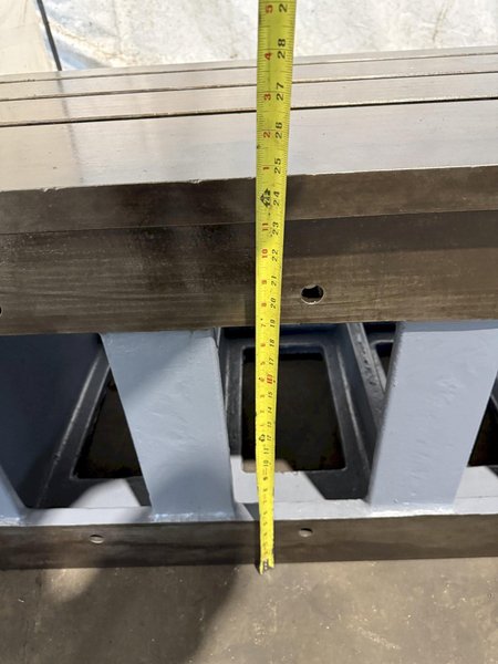 25" WIDE X 89" LONG X 24.5" TALL T-SLOTTED TABLE. STOCK # 0778825