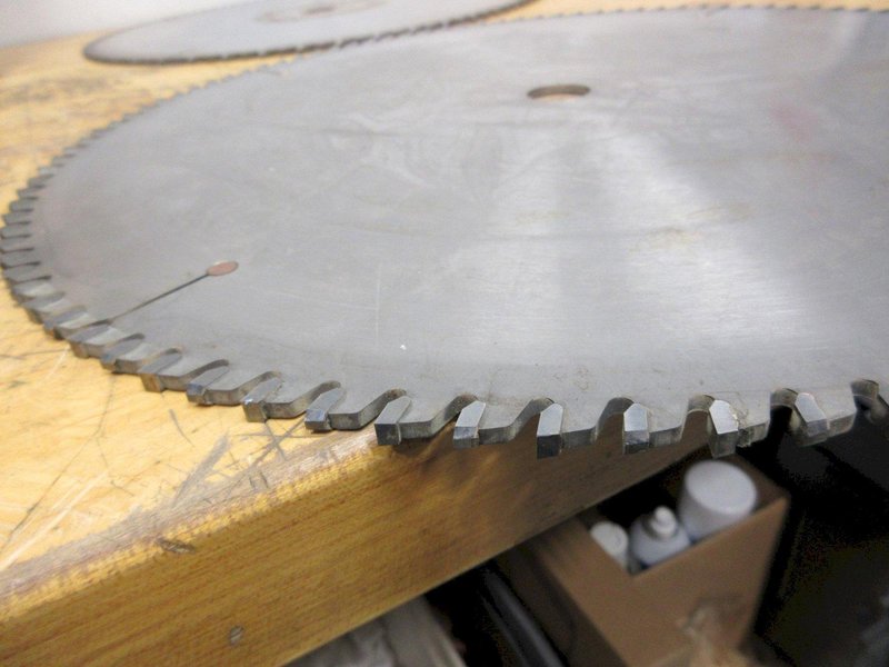 Cut-Off Saw Blades (4) Carbide Tipped Nap Gladu, Leuco and Other 16" x 1" **Used But Still Sharp**, (1) Hitachi 15" x 1" Wood Miter Saw Blade **Looks Unused**- Auction Item