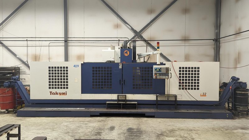 TAKUMI, V32, CNC VERTICAL MACHINING CENTRE, 10,000 RPM SPINDLE, TRAVELS (X,Y,Z): 3200 MM X 1066MM X 750 MM (126&quot; X 42&quot; X 30), DISTANCE FROM NOSE TO SPINDLE:  200MM TO 950MM, DISTANCE FROM SPINDLE NOSE TO THE Z-AXIS GUIDEWAY: 1120MM, T-SLOT TABLE SIZE: 3200MM X 1025MM (126&quot; X 40&quot;), MAX TABLE LOAD, 4500 KG (9,920 LBS), 32 TOOL ATC, TABLE SIZE: 42&quot; X 130&quot;, CAT 50, 30 KW, SPINDLE FLOOD AND THROUGH COOLANT, AIR BLAST, COOLANT FILTER SYSTEM, CHIP WASH DOWN SYSTEM, CHILLED BALL SCREW AND SPINDLE, 4-AXIS CAPABLE,  LEFT AND RIGHT CHIP CONVEYOR,  MITSUBISHI, MEDLAS 60S, CNC CONTROL, 2006, 220/3/60 50 AMP, MACHINE WEIGHT:  52.500 LBS. FLOOR SPACE (W, L, H) 295&quot; X 173&quot; X 139.7&quot; (APPROX.), S/N K0133