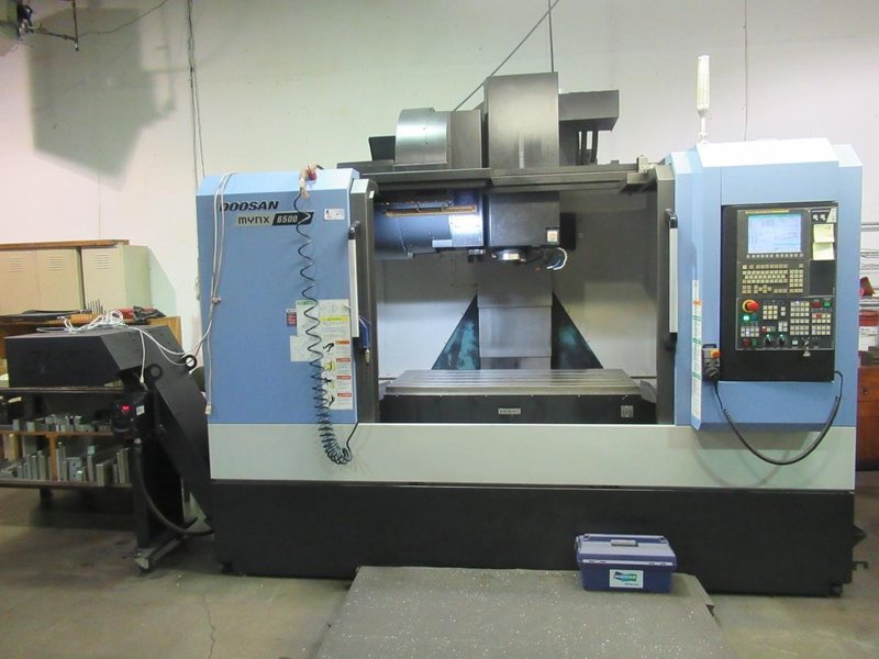 Doosan Mynx 6500/40 CNC Vertical Machining Center with Doosan-Fanuc i Series CNC Control,  30-ATC Thru Spindle Coolant, 12,000 RPM, CAT 40,- Auction Item