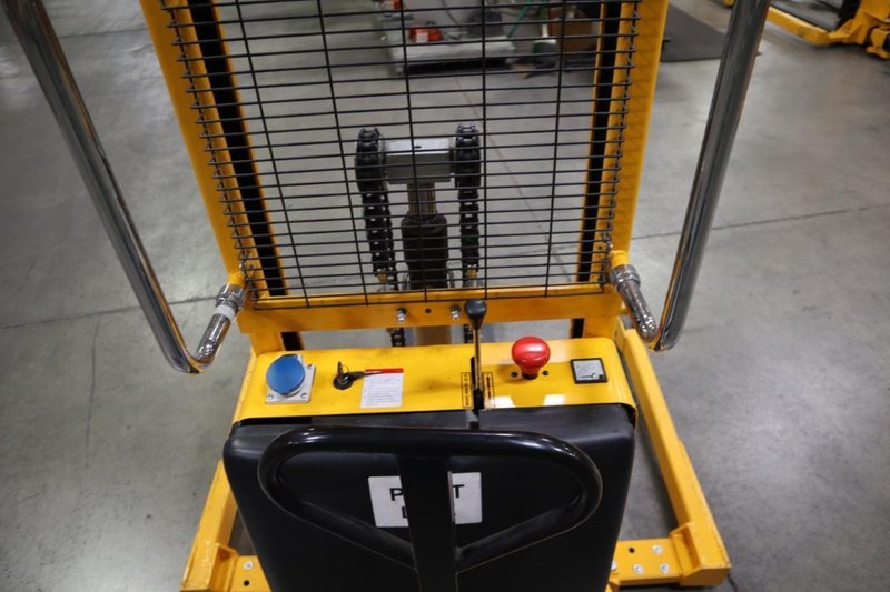 Uline H-2651 Electric Straddle Stacker Lift, 2,200# Cap, 63&quot; Max Height, 50&quot; Between Outriggers, 12 Volt Battery with Charger, 42&quot; Forks- Auction Item