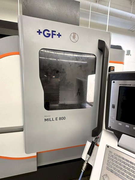 GF Mikron Mill E 800 Vertical 3-Axis Machining Center 2021 With Chiller, Coolant Tank, Chip Conveyor, 20k RPM Step-Tec Motor Spindle, Laser Tool Measuring System, Lift-up Chip Conveyor, Infrared Touch Probe, Glass Scales