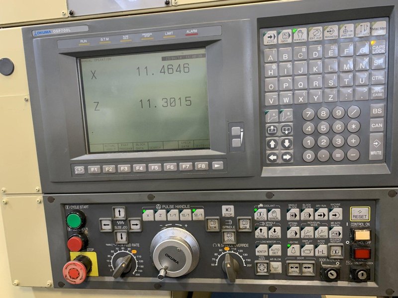 OKUMA Cadet LNC-8C CNC Turning Center, S/N D764, with 10" chuck.