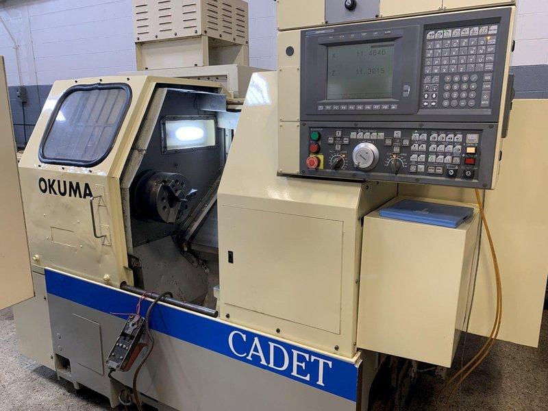 OKUMA Cadet LNC-8C CNC Turning Center, S/N D764, with 10" chuck.