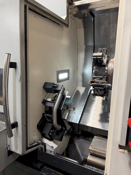 Okuma Genos L-300-MYW-e , 10″ 3-Jaw Kitagawa Chuck Main Spindle, 6″ 3-Jaw Kitagawa Chuck Sub Spindle, Y Axis, 12-Station Live Tool Turret, Tool Presetter, Parts Catcher, Chip Conveyor