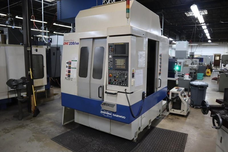 Daewoo Doosan 320/40 CNC Vertical Machining Center with 2 Station Pallet Changer, 12,000 RPM Spindle, 14 Station Rotary Turret, Chip Conveyor- Auction Item
