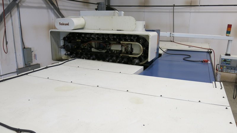 TAKUMI, V32, CNC VERTICAL MACHINING CENTRE, 10,000 RPM SPINDLE, TRAVELS (X,Y,Z): 3200 MM X 1066MM X 750 MM (126&quot; X 42&quot; X 30), DISTANCE FROM NOSE TO SPINDLE:  200MM TO 950MM, DISTANCE FROM SPINDLE NOSE TO THE Z-AXIS GUIDEWAY: 1120MM, T-SLOT TABLE SIZE: 3200MM X 1025MM (126&quot; X 40&quot;), MAX TABLE LOAD, 4500 KG (9,920 LBS), 32 TOOL ATC, TABLE SIZE: 42&quot; X 130&quot;, CAT 50, 30 KW, SPINDLE FLOOD AND THROUGH COOLANT, AIR BLAST, COOLANT FILTER SYSTEM, CHIP WASH DOWN SYSTEM, CHILLED BALL SCREW AND SPINDLE, 4-AXIS CAPABLE,  LEFT AND RIGHT CHIP CONVEYOR,  MITSUBISHI, MEDLAS 60S, CNC CONTROL, 2006, 220/3/60 50 AMP, MACHINE WEIGHT:  52.500 LBS. FLOOR SPACE (W, L, H) 295&quot; X 173&quot; X 139.7&quot; (APPROX.), S/N K0133