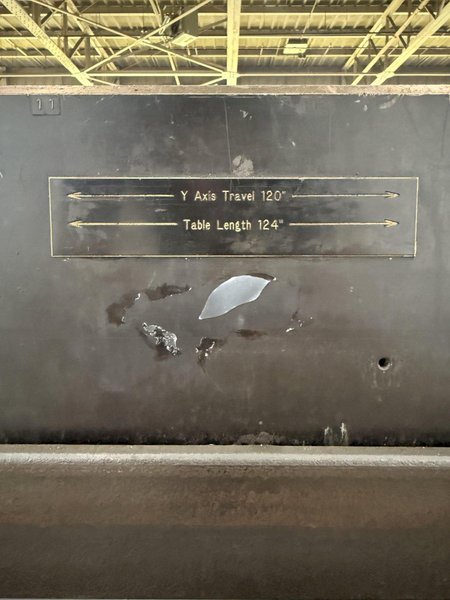 124&quot; X 50&quot; STEEL DRILLED &amp; TAPPED LAYOUT TABLE W/ STAND. STOCK # 0667025.