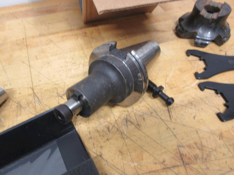 Redline CAT50 Shell Mill Holder, Sandvik 4.5" Shell Mill, ER32 Collet Wrenches, Box of Loc-Line, Zebra Refractometer, 3 Uknown Tool Holders- Auction Item