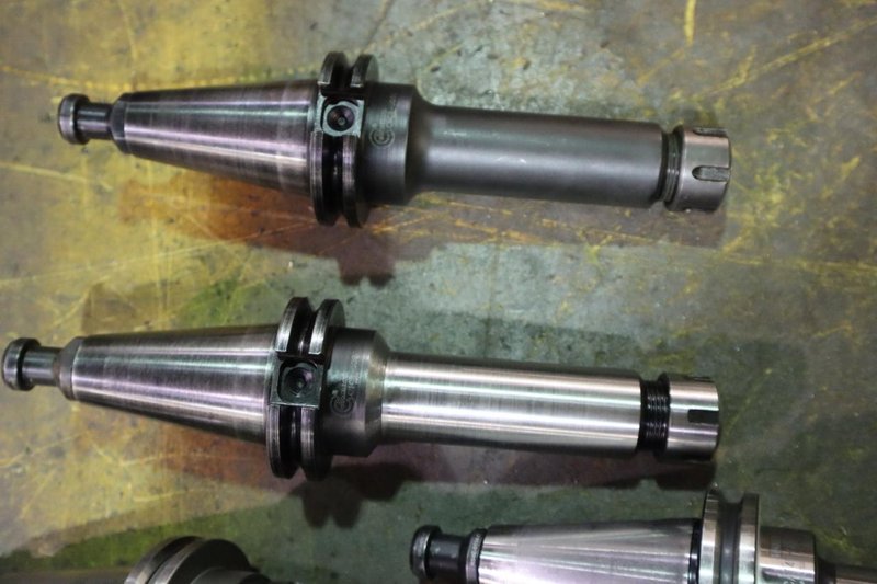 CT 40 Taper Tool Holders: (3) Nikken SK10 Collet Holders, (2) ER20 Collet Holders, (3) ER25 Collet Holders- Auction Item