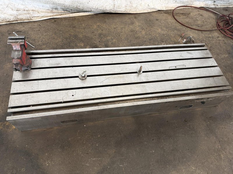 28" WIDE x 83" LONG x 12" TALL T-SLOTTED MACHINE RISER TABLE. STOCK # 0433926