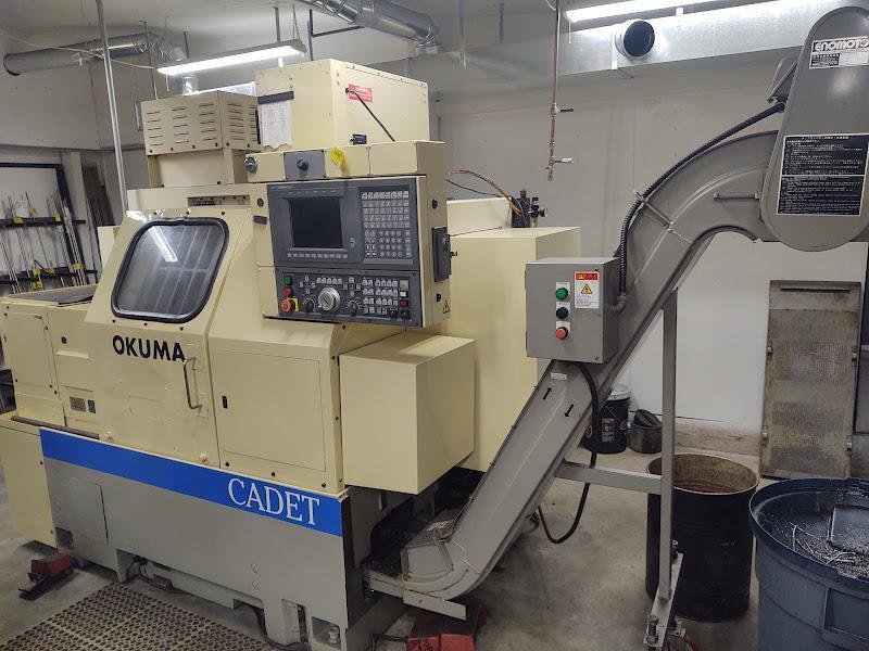 OKUMA Cadet LNC-8C CNC Turning Center, S/N D764, with 10" chuck.