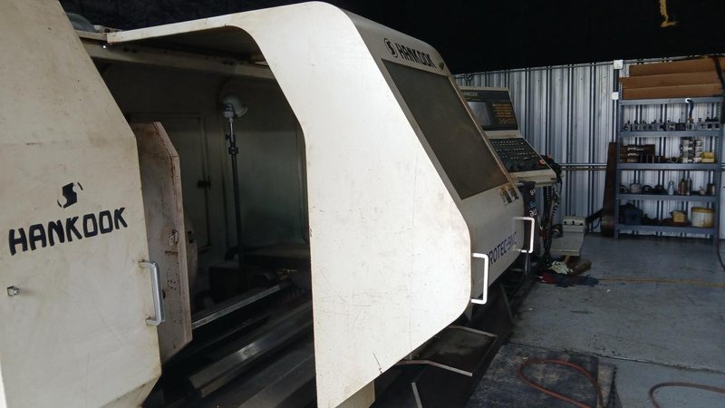 37.4″ x 156″ Hankook Protec 9NC 10″ Spindle Bore, Dual Chucks, 2006 – Chip Conveyor, 8 Station Turret