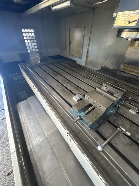 Takumi V32 VMC, 2007 – 4th Axis, CAT50, Box Way, TSC, Chip Conveyor