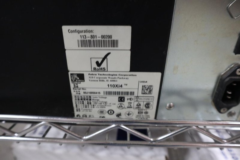 (2) Zebra 110Xi4 Label Printers, 203 dpi, 4&quot; Wide Label Cap - On Wire Cart with Labels- Auction Item