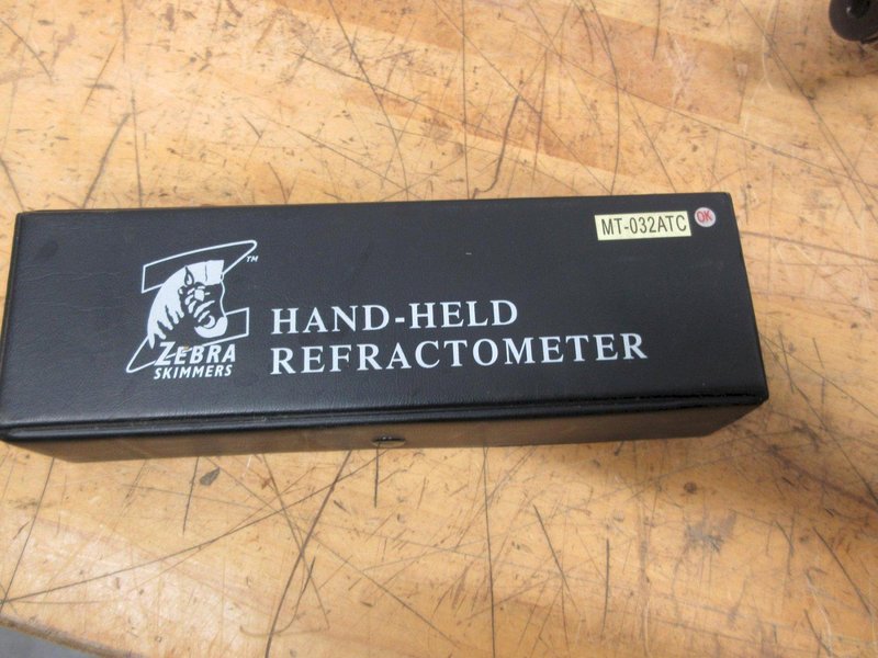 Redline CAT50 Shell Mill Holder, Sandvik 4.5" Shell Mill, ER32 Collet Wrenches, Box of Loc-Line, Zebra Refractometer, 3 Uknown Tool Holders- Auction Item