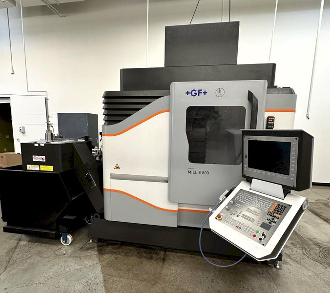 GF Mikron Mill E 800 Vertical 3-Axis Machining Center 2021 With Chiller, Coolant Tank, Chip Conveyor, 20k RPM Step-Tec Motor Spindle, Laser Tool Measuring System, Lift-up Chip Conveyor, Infrared Touch Probe, Glass Scales