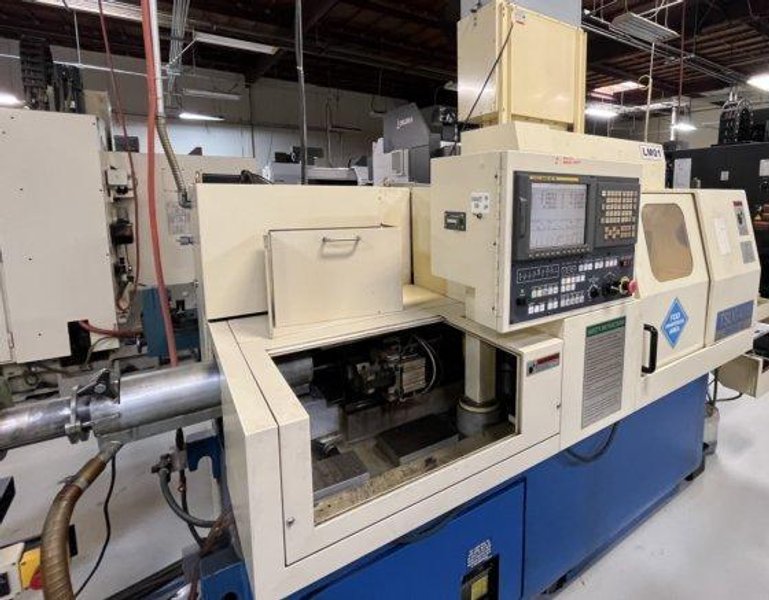 Tsugami BS26-III High-Precision CNC Swiss Lathe equipped with Live Sub-Spindle, Bar Feeder, High Pressure Unit, and Tooling