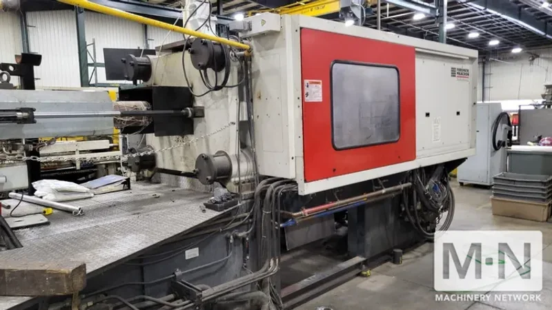 310 TON 36 OZ FERROMATIK MILACRON MODEL MT310-36 WIDE PLATEN INJECTION MOLDING MACHINE MFG 2001