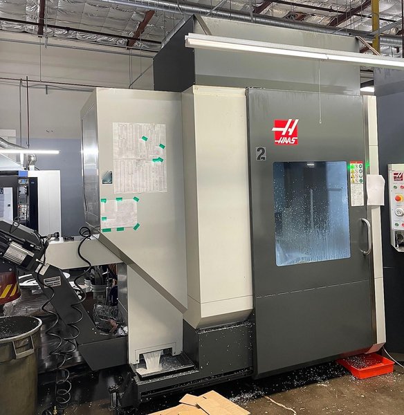 Haas UMC-750 5-Axis Trinity AX-55 Pallet APS 2019 with: Fanuc Robot, High Speed Machining, 40-ATC, 1000 PSI Through Spindle Coolant, Programmable Coolant, and Chip Conveyor.