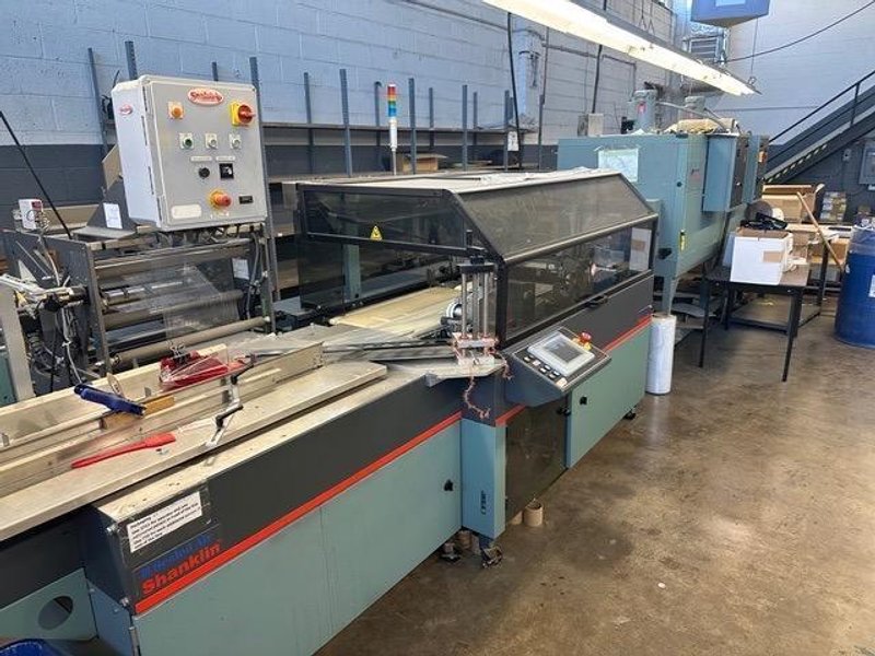 Shanklin OMNI-SLRS Shrink Wrapper with extended Lugged Infeed and T-72H Double Chamber Heat Tunnel, 2007 – Need Gone ASAP