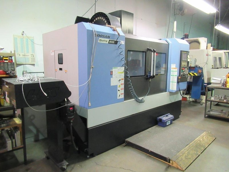 Doosan Mynx 6500/40 CNC Vertical Machining Center with Doosan-Fanuc i Series CNC Control,  30-ATC Thru Spindle Coolant, 12,000 RPM, CAT 40,- Auction Item
