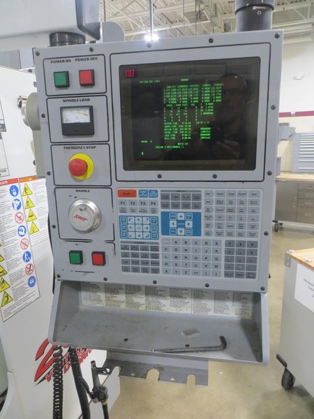 Haas VF-0 CNC Vertical Machining Center, Haas 32-Bit CNC Control, 4th Axis Drive, 20-Station Tool Changer, Programmable Coolant, Remote Jog Handle, Chip Auger - Auction Item