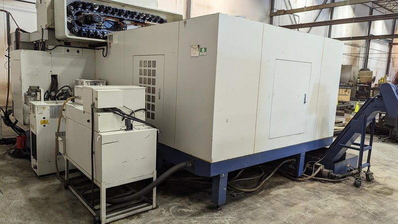 TAKUMI, V32, CNC VERTICAL MACHINING CENTRE, 10,000 RPM SPINDLE, TRAVELS (X,Y,Z): 3200 MM X 1066MM X 750 MM (126&quot; X 42&quot; X 30), DISTANCE FROM NOSE TO SPINDLE:  200MM TO 950MM, DISTANCE FROM SPINDLE NOSE TO THE Z-AXIS GUIDEWAY: 1120MM, T-SLOT TABLE SIZE: 3200MM X 1025MM (126&quot; X 40&quot;), MAX TABLE LOAD, 4500 KG (9,920 LBS), 32 TOOL ATC, TABLE SIZE: 42&quot; X 130&quot;, CAT 50, 30 KW, SPINDLE FLOOD AND THROUGH COOLANT, AIR BLAST, COOLANT FILTER SYSTEM, CHIP WASH DOWN SYSTEM, CHILLED BALL SCREW AND SPINDLE, 4-AXIS CAPABLE,  LEFT AND RIGHT CHIP CONVEYOR,  MITSUBISHI, MEDLAS 60S, CNC CONTROL, 2006, 220/3/60 50 AMP, MACHINE WEIGHT:  52.500 LBS. FLOOR SPACE (W, L, H) 295&quot; X 173&quot; X 139.7&quot; (APPROX.), S/N K0133