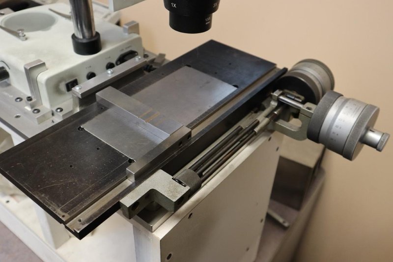 Toolmakers Microscope: AM Stereo 1X-3X  Microscope, w 1.5X Lens and WF 10X/20 Eyepiece Lenses, Scherr Tumico Traveling Stage with Micrometer Hand Travels- Auction Item