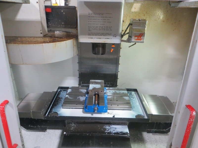 Haas VF-0 CNC Vertical Machining Center, Haas 32-Bit CNC Control, 4th Axis Drive, 20-Station Tool Changer, Programmable Coolant, Remote Jog Handle, Chip Auger - Auction Item